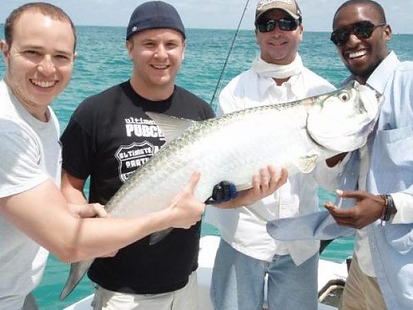   Group of men pose with their catch